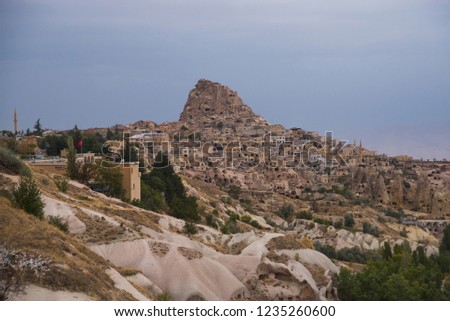 Beautiful view of the mountains and the Uchisar city from the hill. Cappadocia, Central Anatolia, Turkey