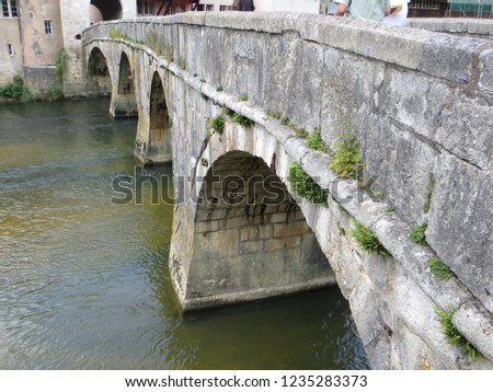 In the Swiss village of Saint-Ursanne, the main stone bridge on the Doubs river