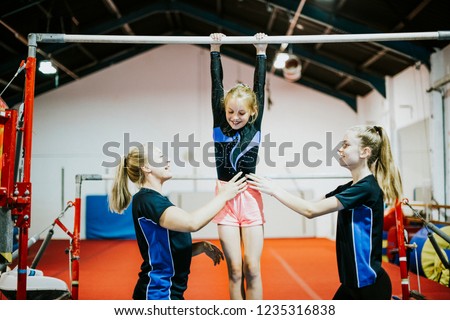 Young gymnast on a horizontal bar