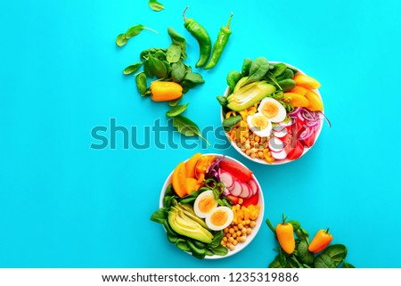 Buddha bowl salad in two bowls, healthy eating concept, view from above, space for a text