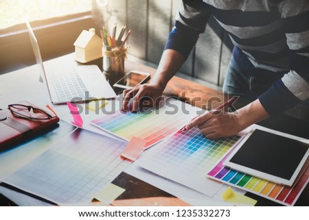 corporate designer graphic creative creativity concept ,man using pen, laptop and tablet to create graphic design coloring colour ideas style house to order customer. engineering and design.