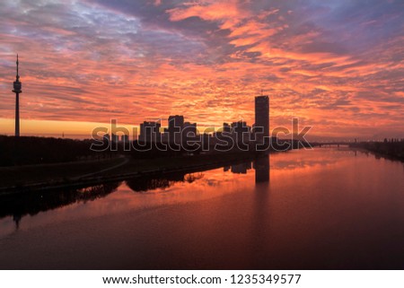 Atmospheric sunrise at the so called Danube Island in Vienna with the amazing skyline of Danube City at the Danube River - Austria. It's one of the most interesting extensive public recreation area in
