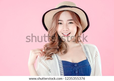 Asian woman tourist happy vacation, summer holiday clothing, pink background