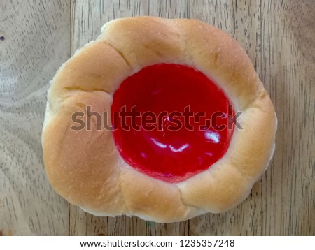 Strawberry jam on bread.