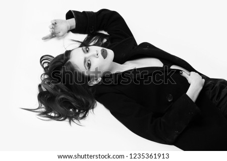 fashion woman in black coat, bra and skirt, girl isolated on white background, has long hair and fashionable lips makeup