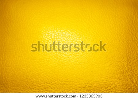 Colored leather yellow background 