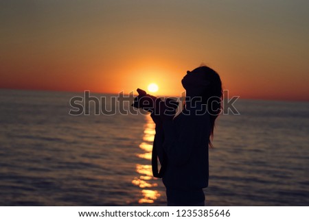 woman with camera at sunset                  