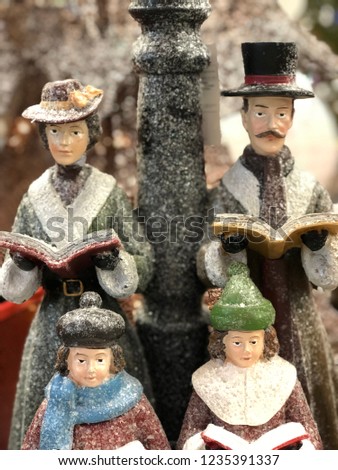 Close up of Christmas carolers - festive holiday decoration