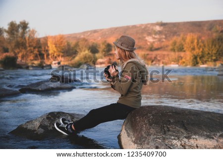 Girl photographer in the water.  Extreme photographer.