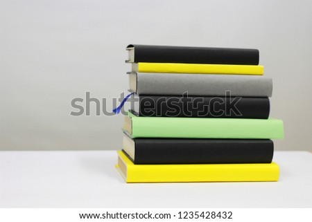 Books in colors on white