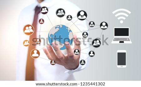 Businessman hold  world or earth icon for security Internet online business (concept pointing security services)