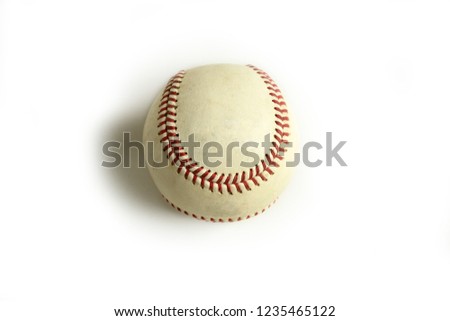 A baseball sits on a white background