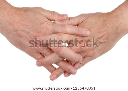 Old elderly  sick men's hands are woven together with fingers as a symbol of friendship and love. Isolated on white studio macro concept