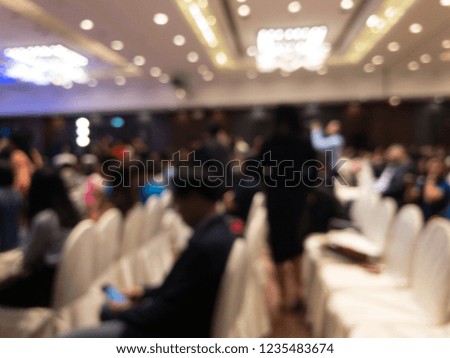 abstract blur of people in press conference seminar