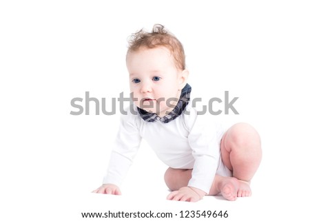 Little baby girl learning to crawl, isolated on white