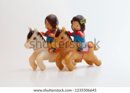 toys isolated in a white background. Dinosauros and horses