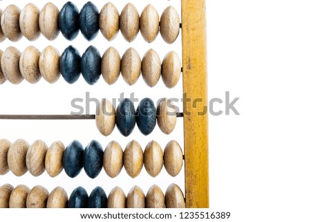 Wooden abacus. Old wooden abacus on bright background. Wooden calculator.
