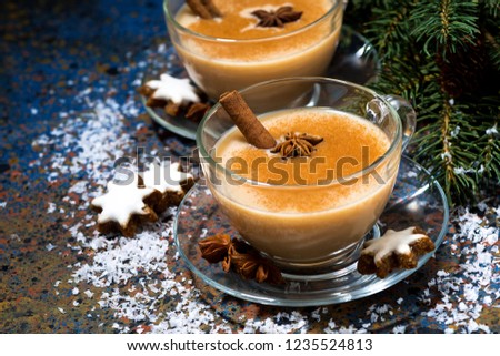 winter spicy masala tea and cookies on table, closeup