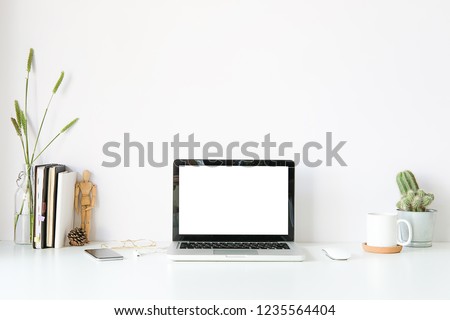 workspace desk and laptop. copy space and blank screen. Business image, Blank screen laptop and supplies. Royalty-Free Stock Photo #1235564404