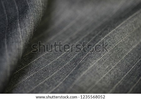 close up silver texture fabric of suit, photoshoot by depth of field for object