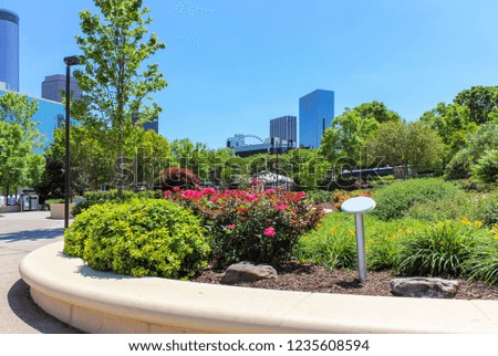Beautiful view from downtown park with foreground flowers and trees on Atlanta skyline