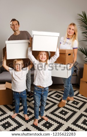 Full-length picture of women, men and children holding cardboard boxes