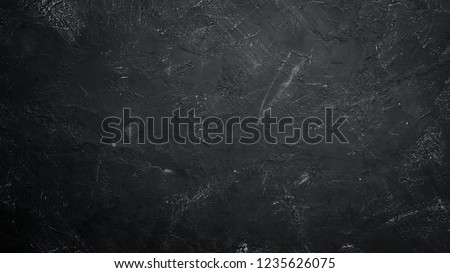 Black stone background. Black surface. Top view. Free space for your text. Royalty-Free Stock Photo #1235626075