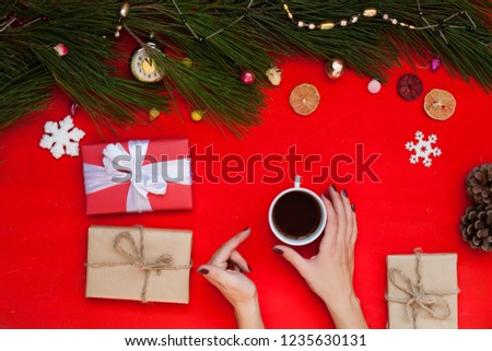 women's hands hold gift Christmas tree Christmas New Year holiday coffee background