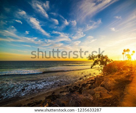 Malibu beach under a colorful sky at sunset, Los Angeles. Southern California, USA