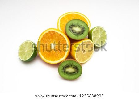 Creative layout made of fruits. Flat lay. lemon, orange, lime, kiwi, on the white background.