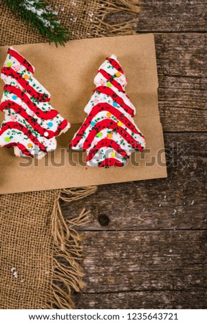 Christmas Background with Christmas Tree Cakes on Wooden Background. Selective focus.