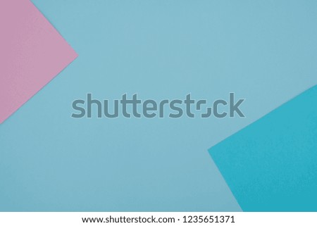 Blue and pink pastel color paper geometric flat lay background -