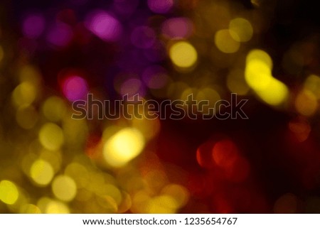 Bokeh. Holiday background. Christmas lights. Glitter. Defocused sparkles. New Year backdrop. Festive wallpaper. Blinks. Carnival. Tinsel. Bokeh retro style photo.