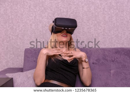 Woman playing VR device at home