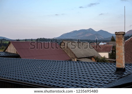 country village rooftops in Slovakia with mountains in background