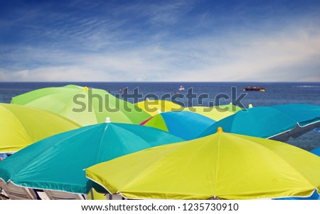 Colorful open beach parasols under the sun at the Black Sea in Odessa, Ukraine