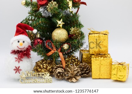 Christmas tree and snowman with red hat. 