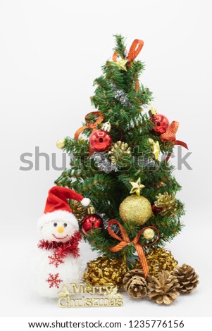 Christmas tree and snowman with red hat. 