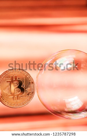 Bitcoin and the bubble as an abstract symbol of the risks of a digital currency and possible collapse and abrupt change of course (falling, collapse, fiasco, fraud - the concept)