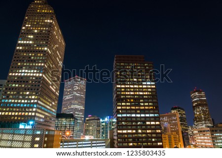 Night Skyline Denver , Colorado Nightscape Growing Towers and office buildings right in the middle of Downtown Denver in the middle of the night