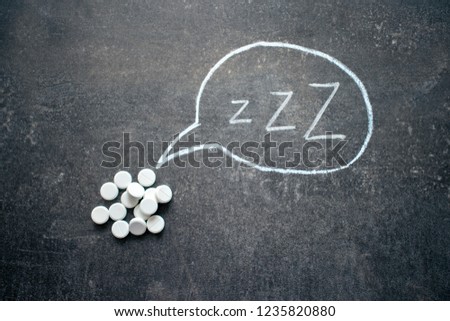 White pills in Z shape and text. Sleeping pills, hypnotic drugs, sedative, melatonin on dark night background Royalty-Free Stock Photo #1235820880