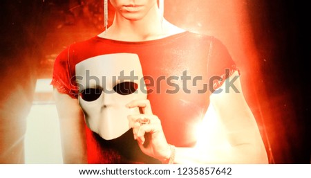 young woman holding mask Royalty-Free Stock Photo #1235857642