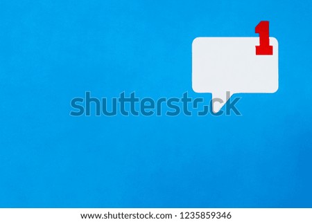 Paper speech bubble concept on blue background. Social Media Chat concept. Icon with one new message.