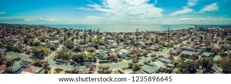 Aerial panorama of Frankston suburb and Mornington Peninsula coastline on hot sunny day