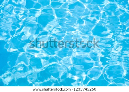 Blue water in swimming pool background
