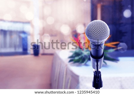 Microphone on boom stand ready for the meeting. Microphone on stage in conference hall.