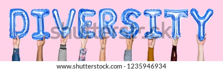Hands holding diversity word in balloon letters