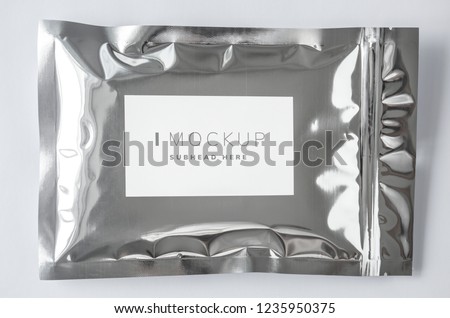 Resealable metallic packaging bag mockup Royalty-Free Stock Photo #1235950375