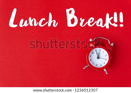 Vintage free time in office holiday hour red background concept alarm clock on work holiday, paper color in minimal style, take time template for break, break lunchtime at school for lunch.