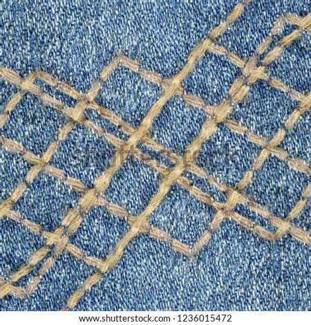 blue denim background decorated with seams. Useful for design-works 